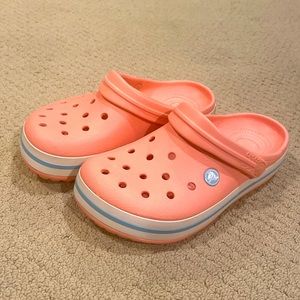 Pink crocs with white stripe size womens 6/ mens 4